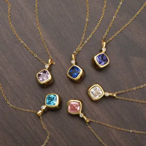 Detail view of multiple birthstone necklaces in varied zircon colors and gold plating.