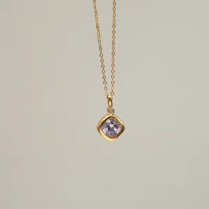 Close-up detail of 18K gold plated necklace featuring a square lavender zircon pendant
