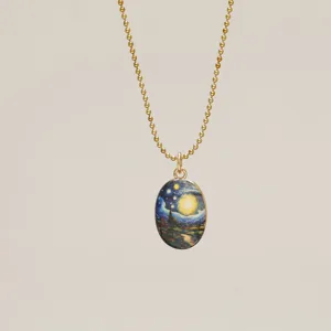 Detail shot of a gold ball chain necklace featuring a Van Gogh Starry Night pendant.