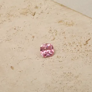 Close-up of cushion cut pink zircon gemstone for personalized necklace