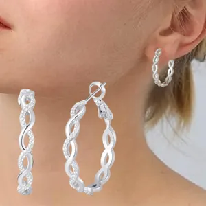 Close-up detail of S925 sterling silver braided hoop earrings with micro-pave zirconia