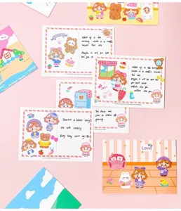 Macro view of cute girl and animal character stickers on decorative postcards
