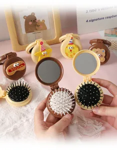 Portable cartoon folding airbag hairbrush with mirror, cute mini massage comb for travel.