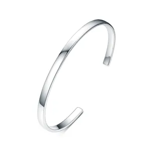 Detail of minimalist 925 sterling silver open cuff bracelet with polished finish