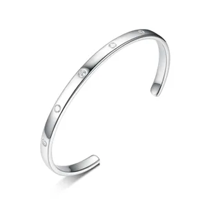 Detailed close-up view of a minimalist 925 sterling silver cuff bracelet with embedded stones