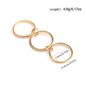 Macro view of three-layer stacked minimalist gold titanium ring with measurement labels