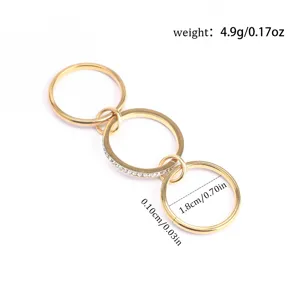 Close-up of gold titanium steel triple stacked rings with dimensions and weight specs.