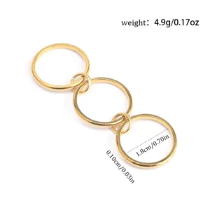 Detail view of 1.8cm gold titanium steel triple stack rings with weight and size labels.