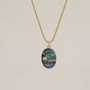 Close-up of oval pendant featuring Van Gogh's Starry Night on a gold ball chain