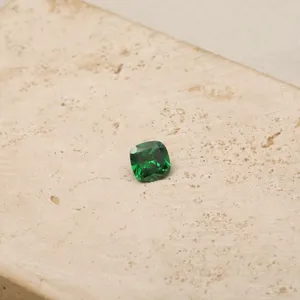 Close-up of a cushion-cut green zircon gemstone for birthstone jewelry