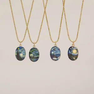 Close-up of four artistic Van Gogh night sky pendants on gold bead chains