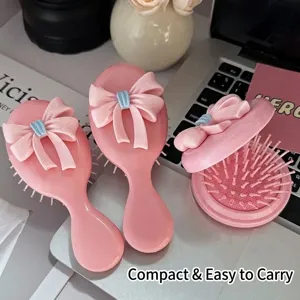 Cute pink bow-knot folding airbag hair comb with an integrated mirror for travel