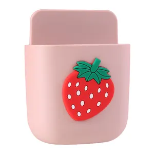 Pink wall-mounted storage box with a cute strawberry cartoon design, punch-free wall organizer