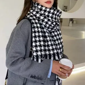 Detail view of a classic black and white houndstooth cashmere-like scarf