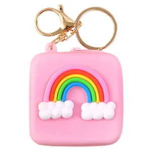 Pink silicone rainbow coin purse and wireless earphone case with golden keychain