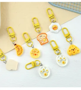 Variety of cute resin food keychains featuring toast, eggs, and cheese designs