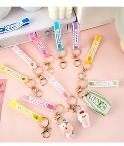 Detailed view of colorful PVC wrist strap keychains with cute cartoon animal charms