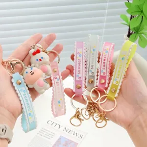 Cute PVC cartoon animal keychain with colorful SUMMER silicone wrist straps and gold clasps.