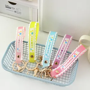 Colorful PVC soft rubber wristband keychains with Summer design in blue basket