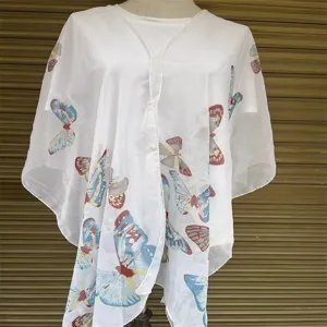 Detailed view of a lightweight white butterfly print sun protection shawl on a mannequin.