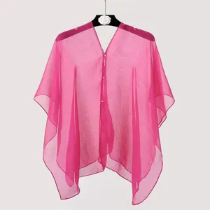 Close-up of lightweight pink chiffon sun protection shawl with elegant drape and pearl buttons