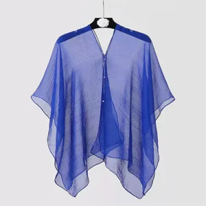 Close-up detail showing the sheer chiffon fabric texture of the blue sunshade shawl.