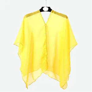 Detailed view of bright yellow chiffon sunscreen shawl with elegant button closure