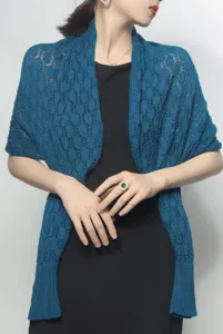 Elegant detail view of women's blue ice silk knitted shawl with honeycomb pattern