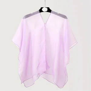 Detailed view of a lightweight lavender purple chiffon shawl used as a beach cover-up