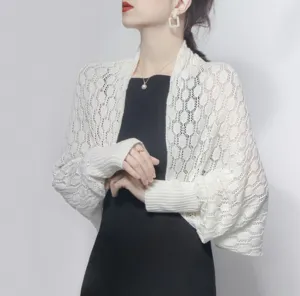 Elegant white honeycomb knit shrug shawl for women styled over a chic black dress