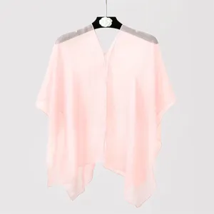 Detailed view of a sheer pink chiffon sun protection shawl for summer beachwear.