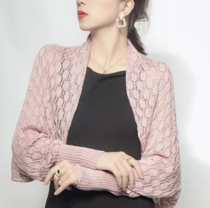 Detailed view showing the honeycomb knit texture of this elegant pink shrug shawl