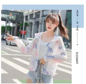 Full view of women's floral breathable sun protection jacket in urban street setting