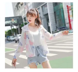 Close-up street view of a lightweight women's floral sun protection jacket with hood