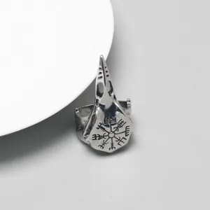 Detailed macro view of Viking crow skull ring with engraved Vegvísir rune symbols