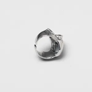 Detailed side view of silver Viking skull ring with intricate raven skull and rune engraving