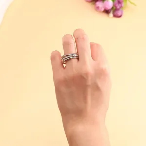 Detailed close-up showing the elegant design of a three-layer stacked ring on hand.