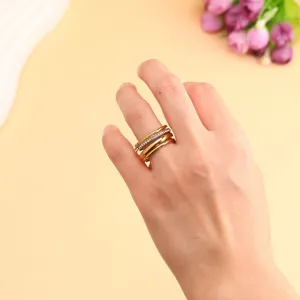 Detail showing the layered texture and sparkling zircons of the gold stacked ring