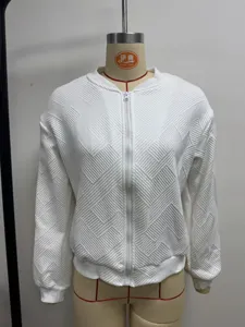 Close-up of white women's bomber jacket with textured geometric quilted pattern