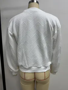 Back view of a white women's jacket featuring a unique geometric quilted texture.