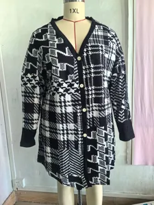 Detailed view of black and white patterned loose cardigan on a 1XL mannequin