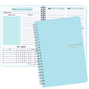 Detailed view of internal pages and cover of this light blue spiral weekly planner.