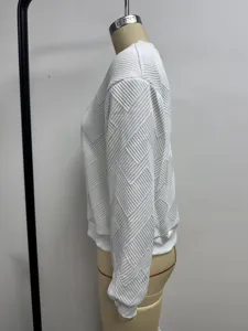 Detailed side view showing the textured geometric pattern of the white women's casual jacket.