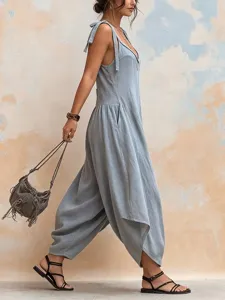 Detailed side view of a stylish light blue linen jumpsuit with V-neck and pockets