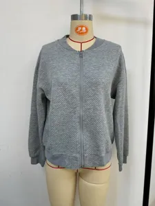 Close-up detail of women's gray textured zip-up jacket featuring a baseball collar design