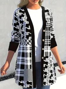 Macro view of women's black and white houndstooth patchwork long cardigan jacket.