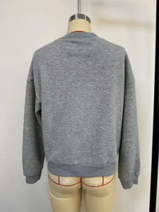 Detailed back view of grey textured women's casual sweatshirt with ribbed cuffs and hem