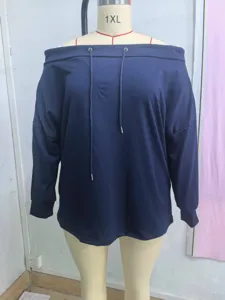 Detail of a navy blue off-shoulder sweatshirt featuring drawstring accents.