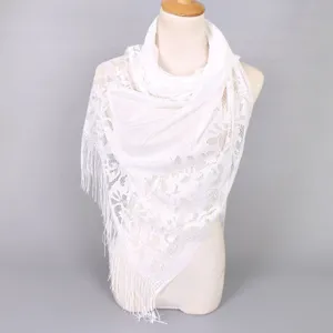 Elegant white floral lace shawl with long fringes displayed on a mannequin torso