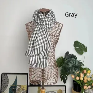 Classic gray and white houndstooth cashmere-like scarf shown on a wire mannequin